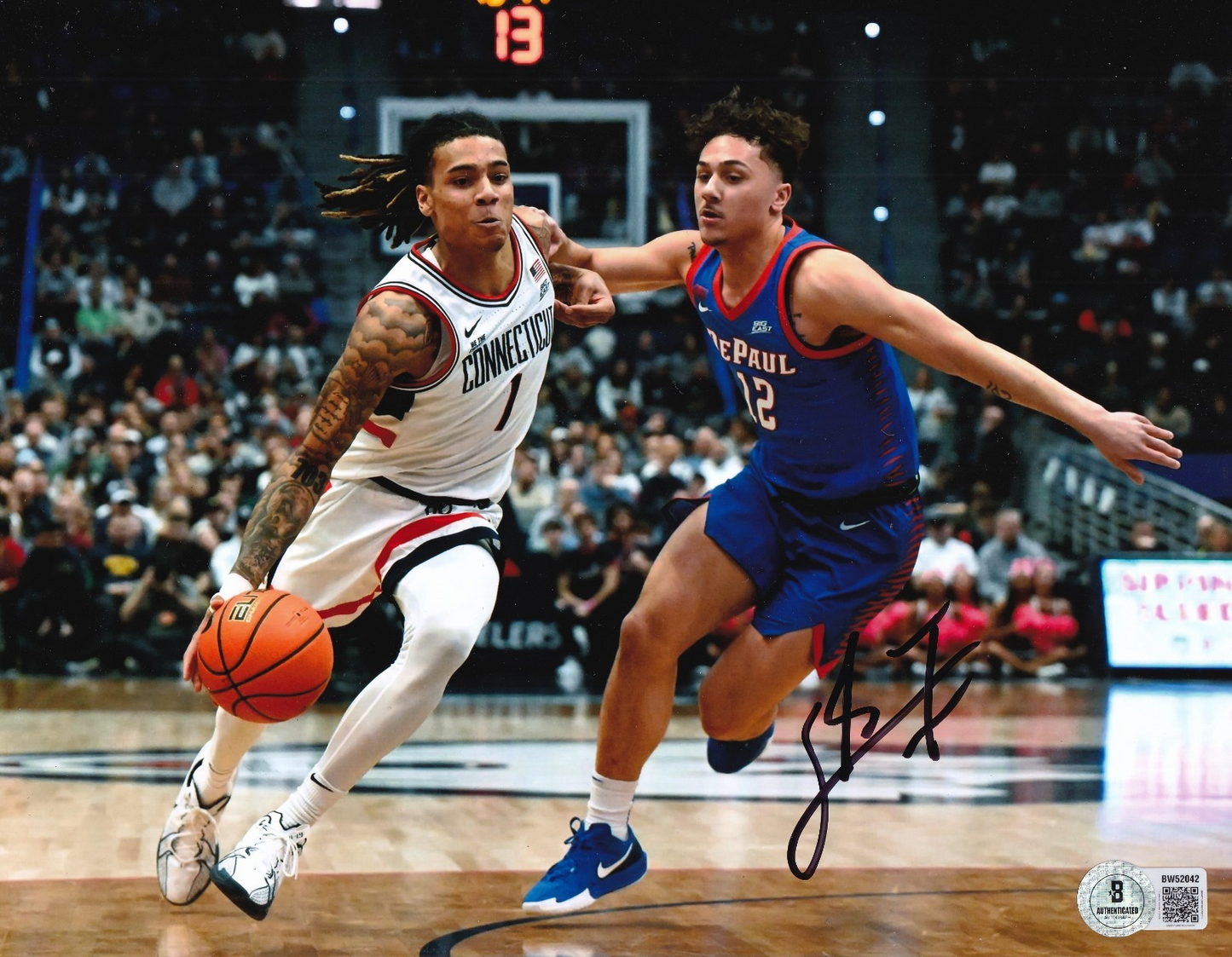 SOLO BALL signed (UCONN HUSKIES) Connecticut basketball 8X10 BECKETT BW52042