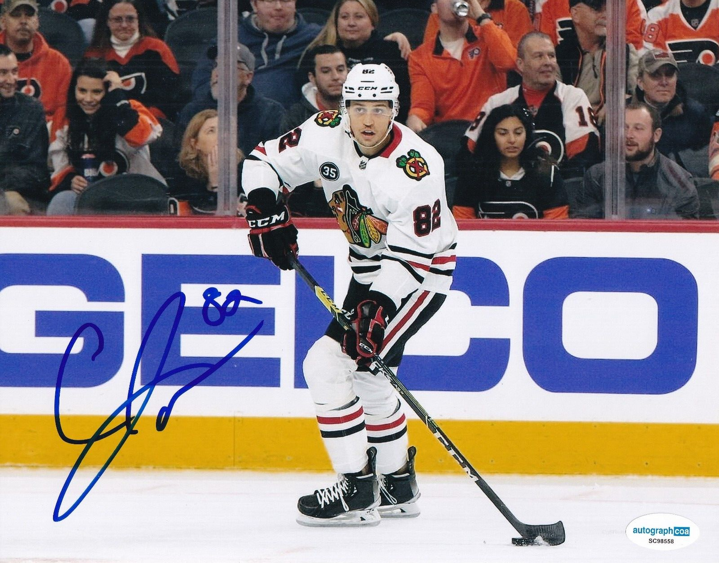 CALEB JONES signed (CHICAGO BLACKHAWKS) Hockey 8X10 photo ACOA SC98558