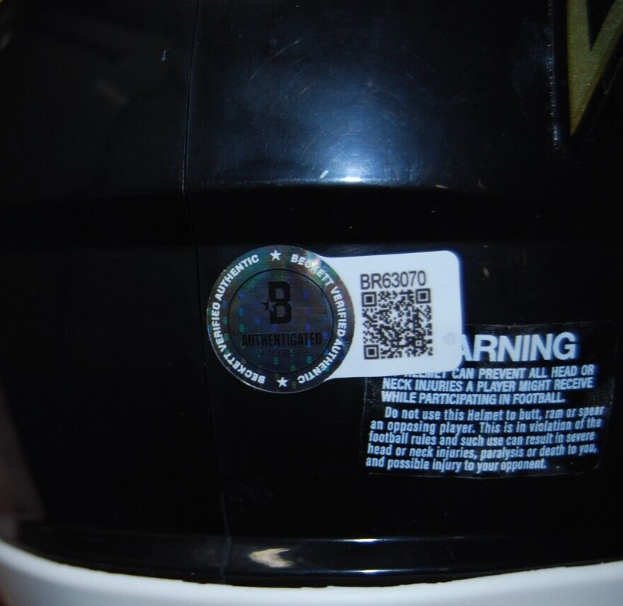 JOHN HARBAUGH signed (BALTIMORE RAVNES) mini football helmet BECKETT BR63070