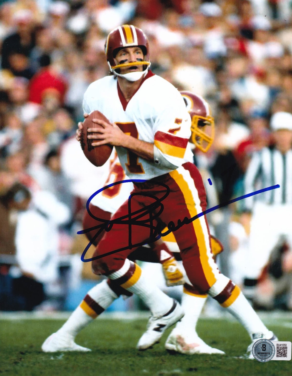 JOE THEISMANN signed (WASHINGTON REDSKINS) football 8X10 photo BECKETT BU41050