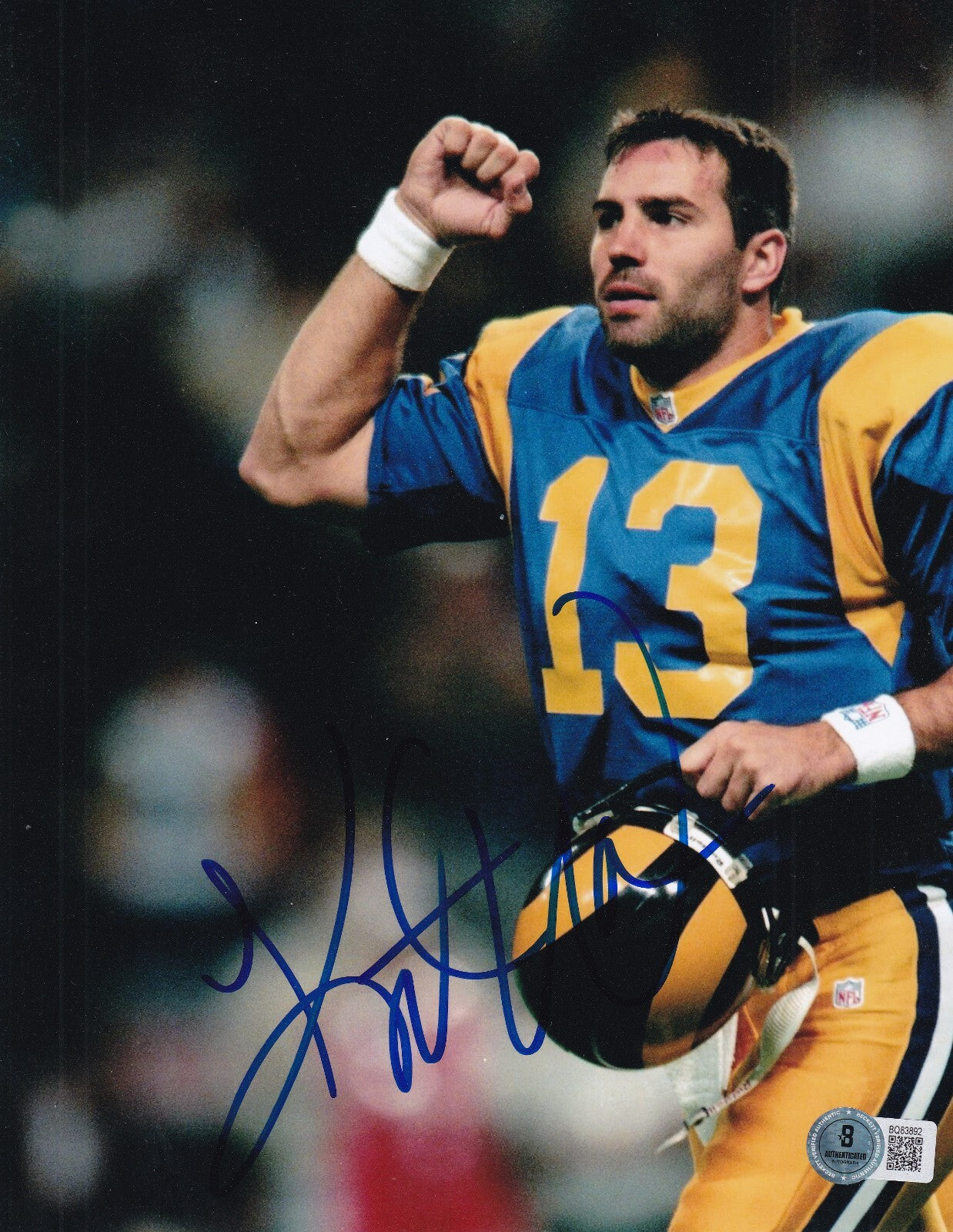 KURT WARNER signed (ST LOUIS RAMS) football 8X10 photo BECKETT BAS BQ83892