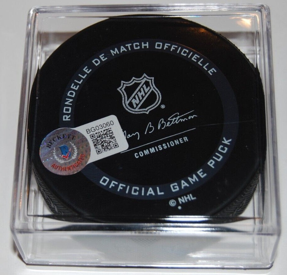 ED BELFOUR signed (CHICAGO BLACKHAWKS) Official game hockey puck BECKETT BG03060