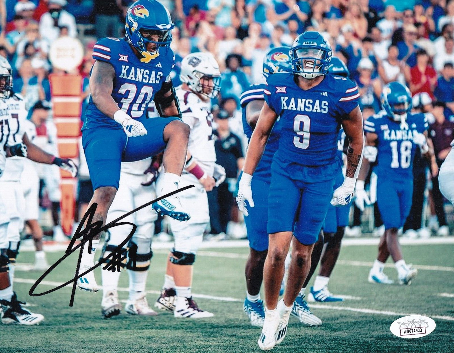 AUSTIN BOOKER signed (KANSAS JAYHAWKS) Football 8X10 photo JSA Witness WB674923