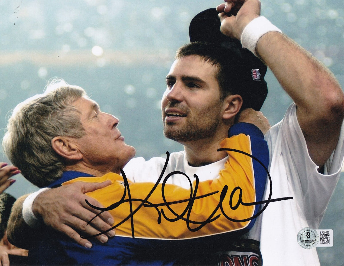 KURT WARNER signed (ST LOUIS RAMS) football 8X10 photo BECKETT BAS BP09566