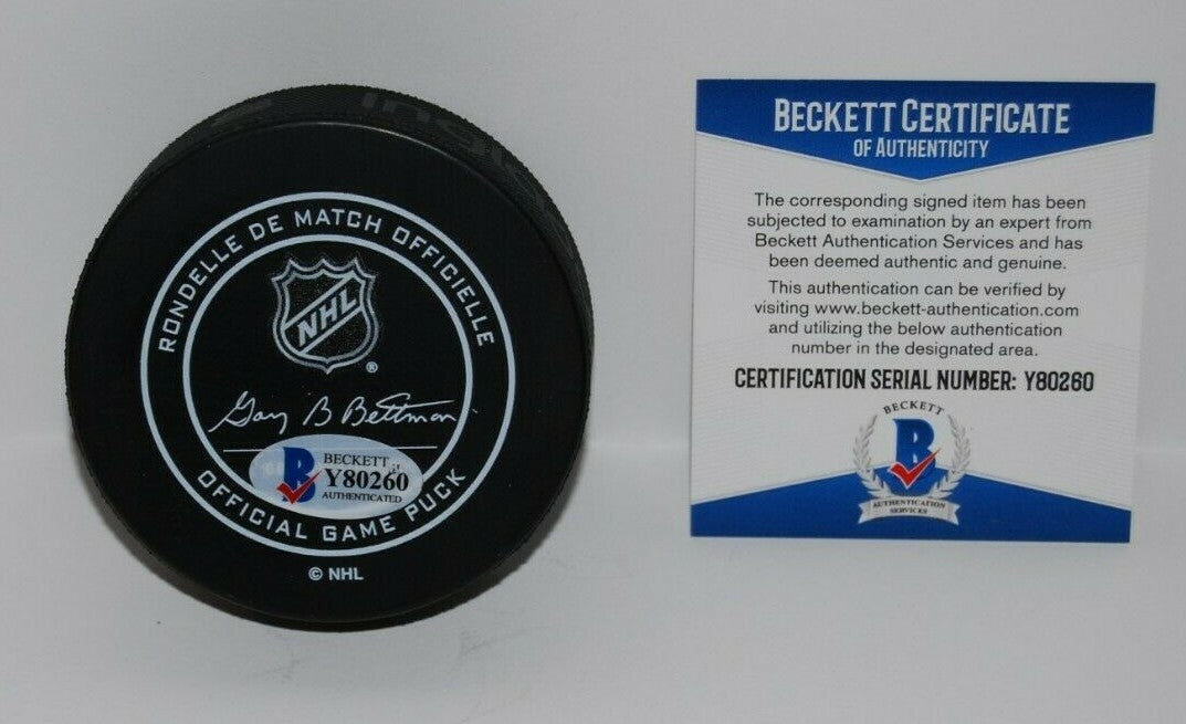 ED BELFOUR signed (DALLAS STARS) Official game hockey puck BECKETT BAS Y80260