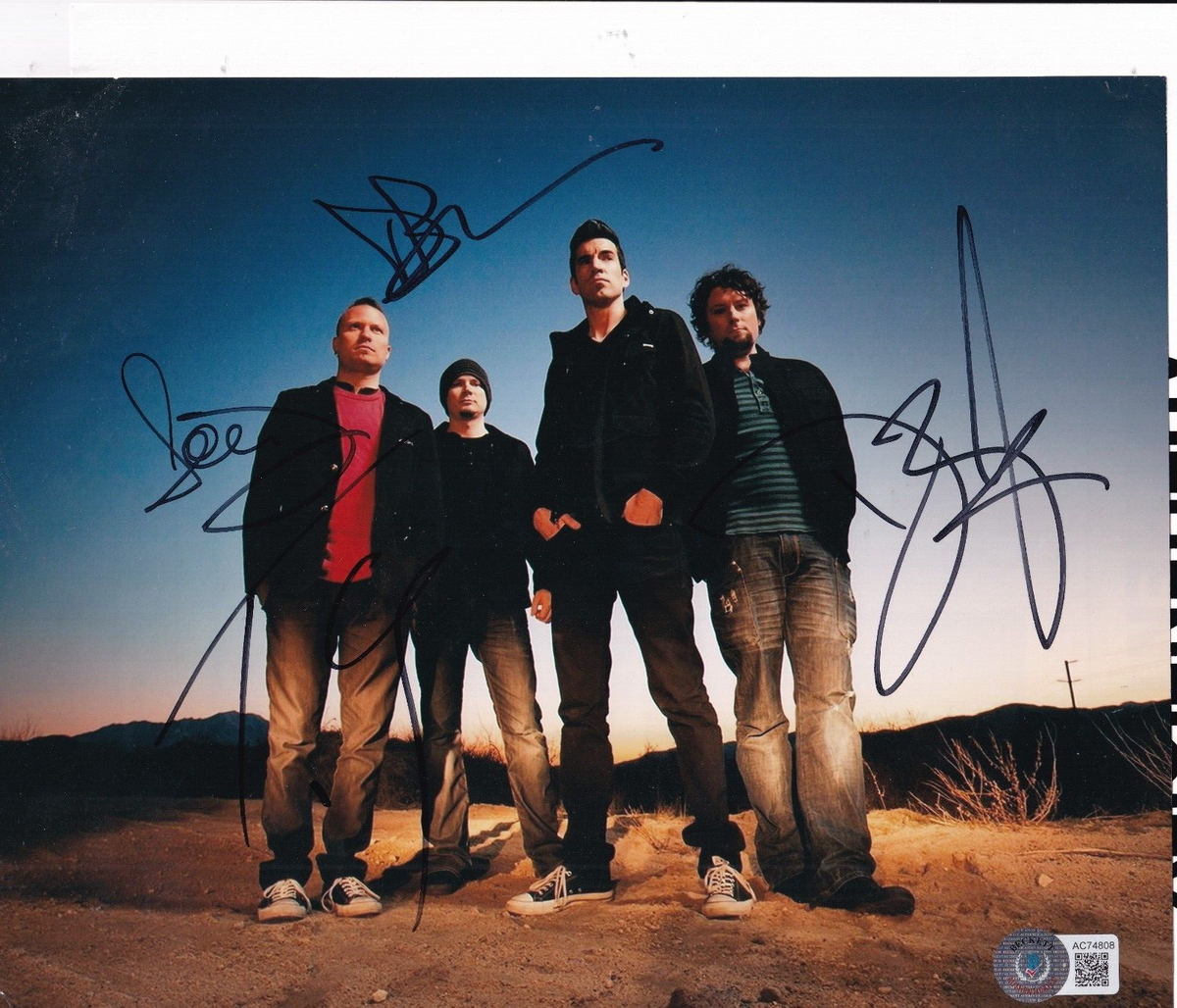 IMAGINE DRAGONS group signed 8X10 photo (BONES EVOLVE) Beckett AC74808