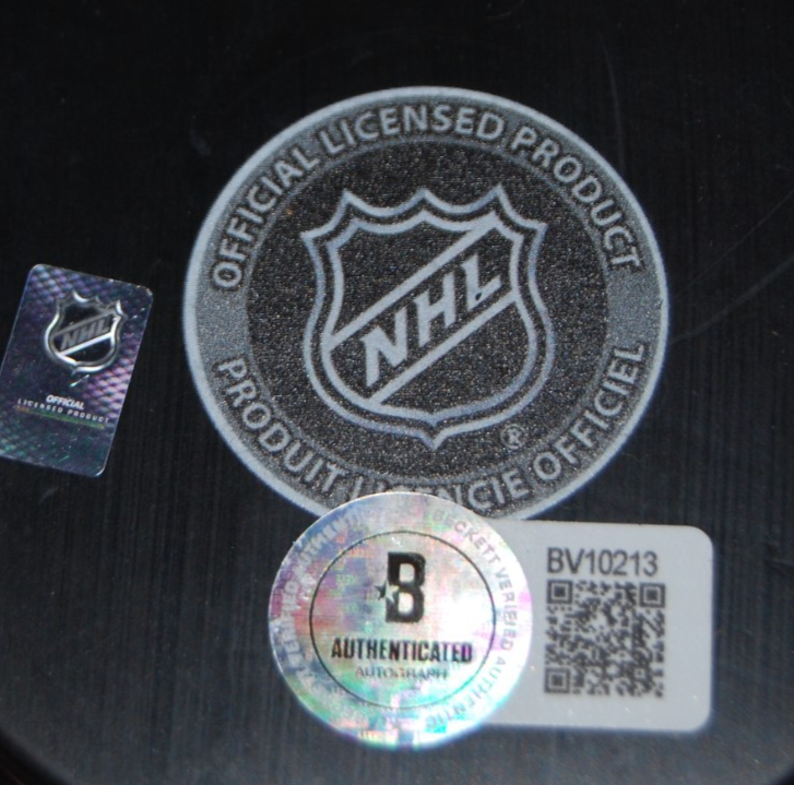 COLTON DACH signed (CHICAGO BLACKHAWKS) 100th Anniversary puck BECKETT BV10213