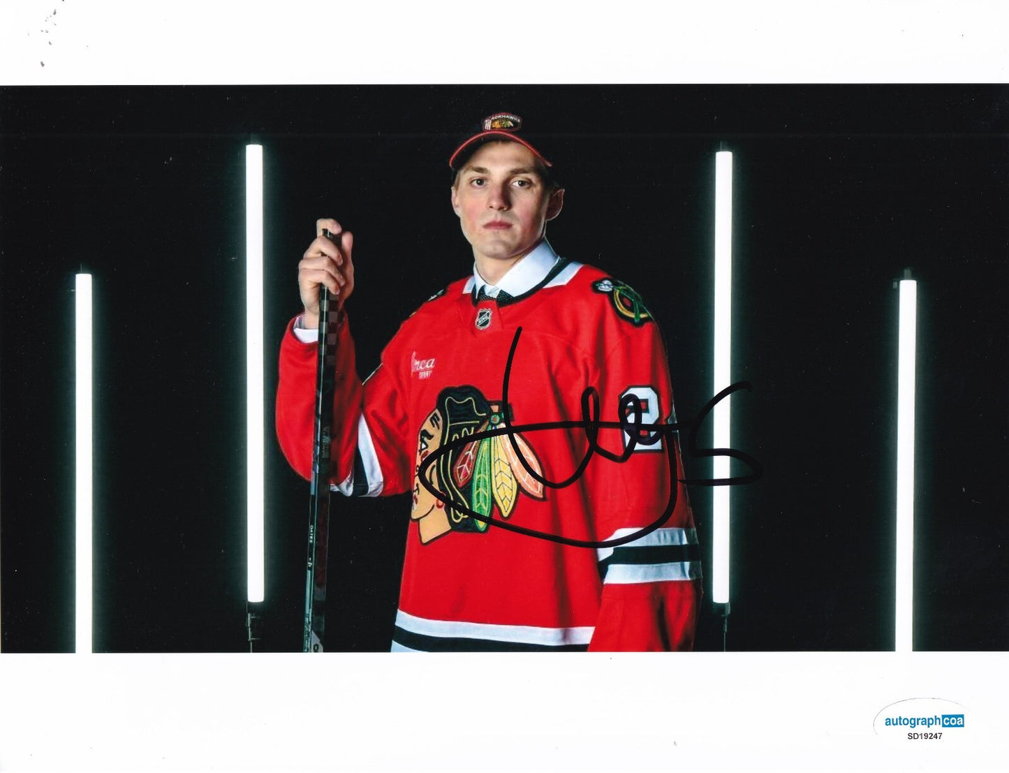 ARTYOM LEVSHUNOV signed (CHICAGO BLACKHAWKS) Hockey 8X10 photo ACOA SD19247