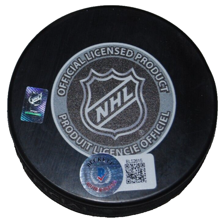 DOUG GILMOUR signed (CALGARY FLAMES) 1989 Champs hockey puck BECKETT BAS BL52615