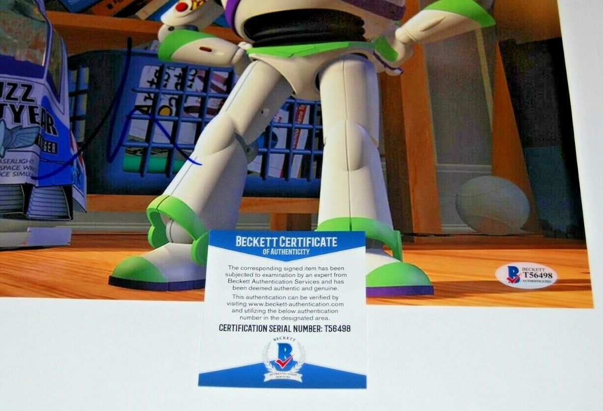 TIM ALLEN signed (TOY STORY) Movie 11X14 (BUZZ LIGHTYEAR) *PROOF* BECKETT BAS #1