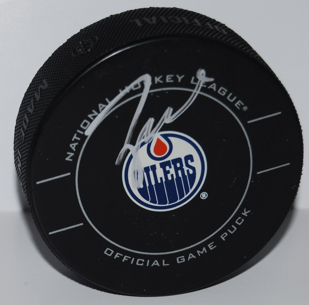 TAYLOR HALL signed (EDMONTON OILERS) Official game hockey puck W/COA #4