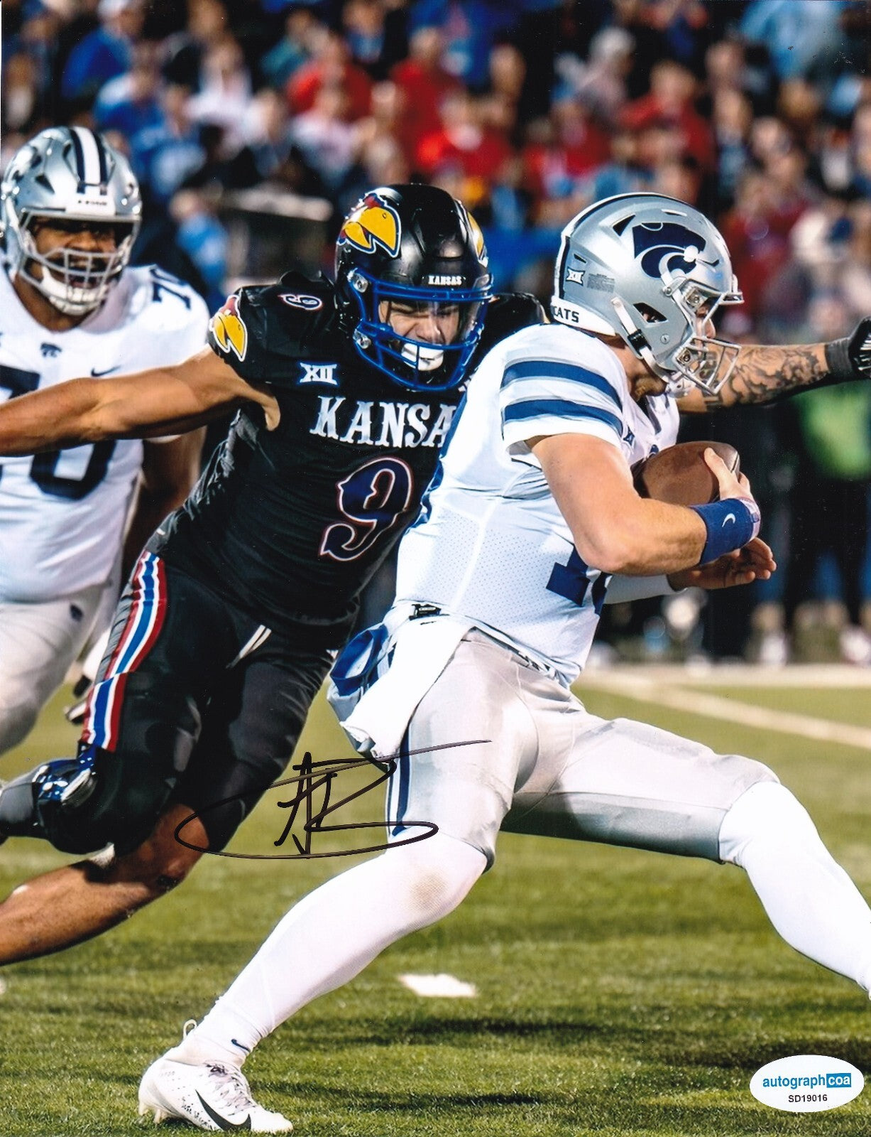 AUSTIN BOOKER signed (KANSAS JAYHAWKS) Football 8X10 photo ACOA SD19016