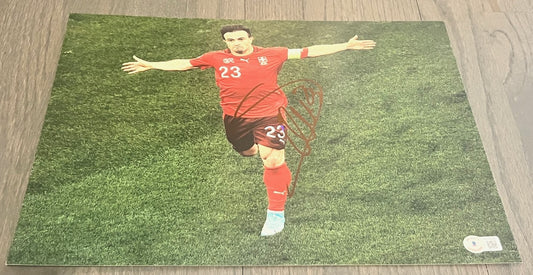 XHERDAN SHAQIRI signed (LIVERPOOL Switzerland Soccer 11X14 photo BECKETT AC93448