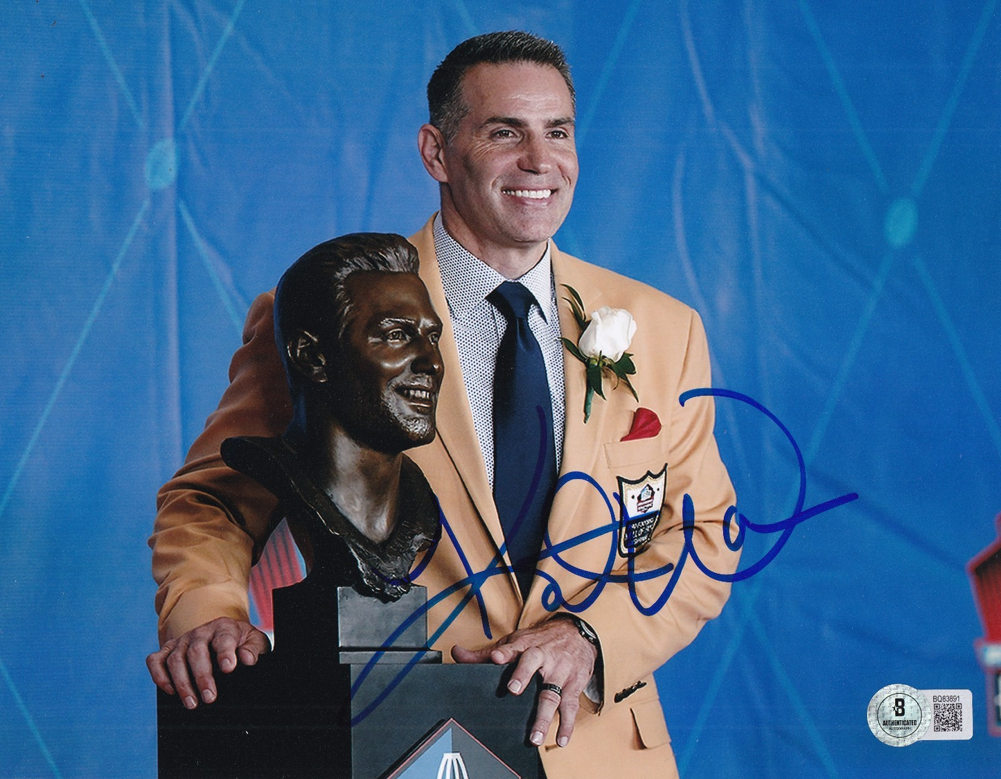 KURT WARNER signed (ST LOUIS RAMS) football 8X10 photo BECKETT BAS BQ83891