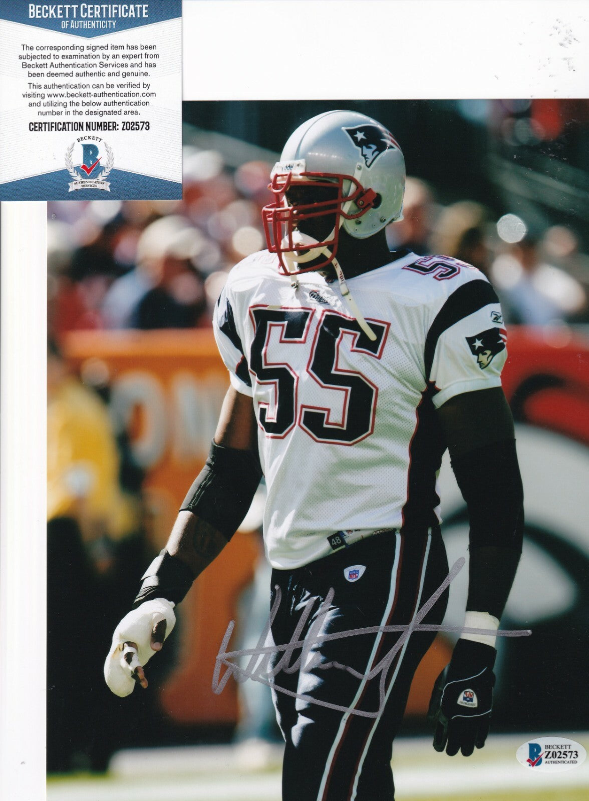 WILLIE MCGINEST signed (NEW ENGLAND PATRIOTS) Football 8X10 photo BECKETT Z02573