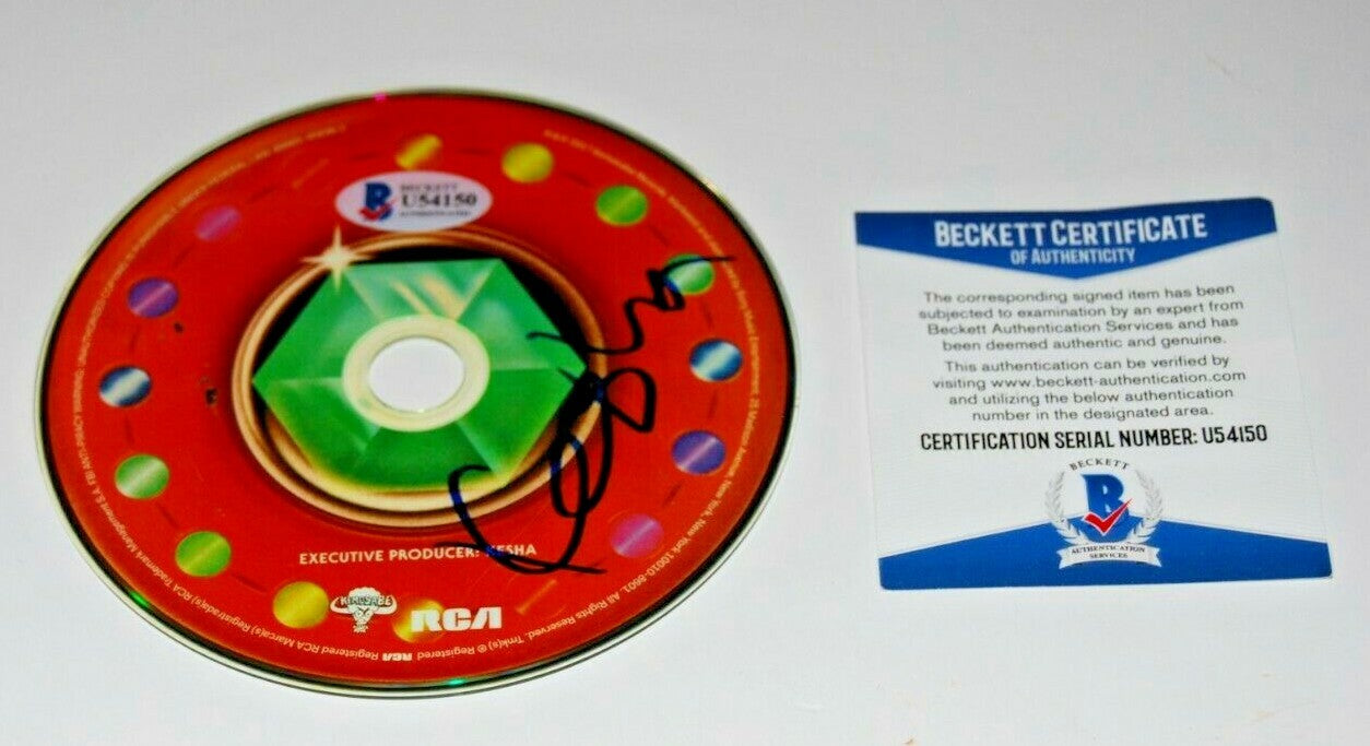 KESHA signed (RAINBOW) CD *FULL NAME* W/COA *KE$HA*autographed (PRAYING) BECKETT