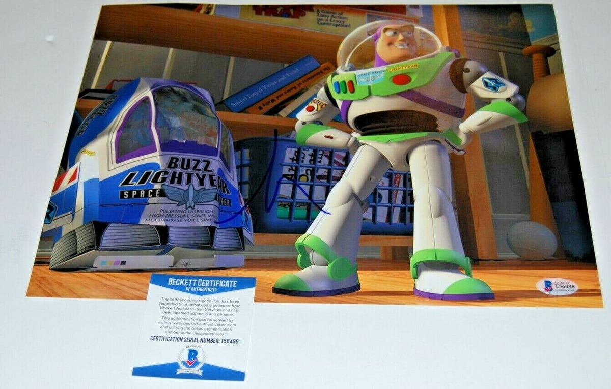 TIM ALLEN signed (TOY STORY) Movie 11X14 (BUZZ LIGHTYEAR) *PROOF* BECKETT BAS #1