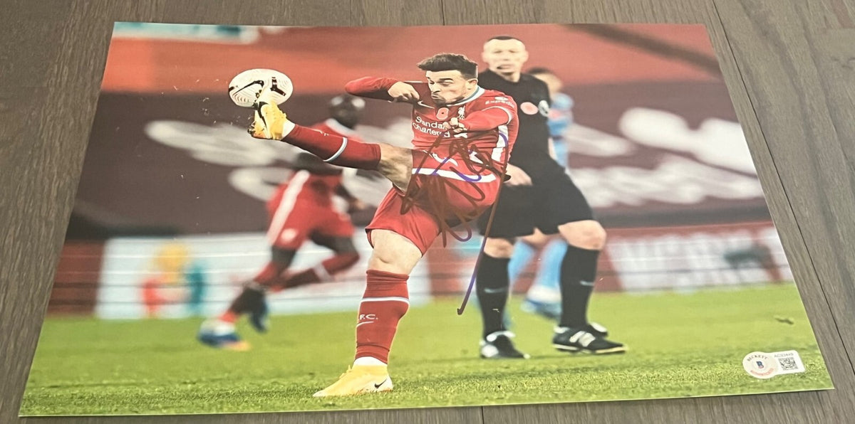 XHERDAN SHAQIRI signed (LIVERPOOL Switzerland Soccer 11X14 photo BECKETT AC93449