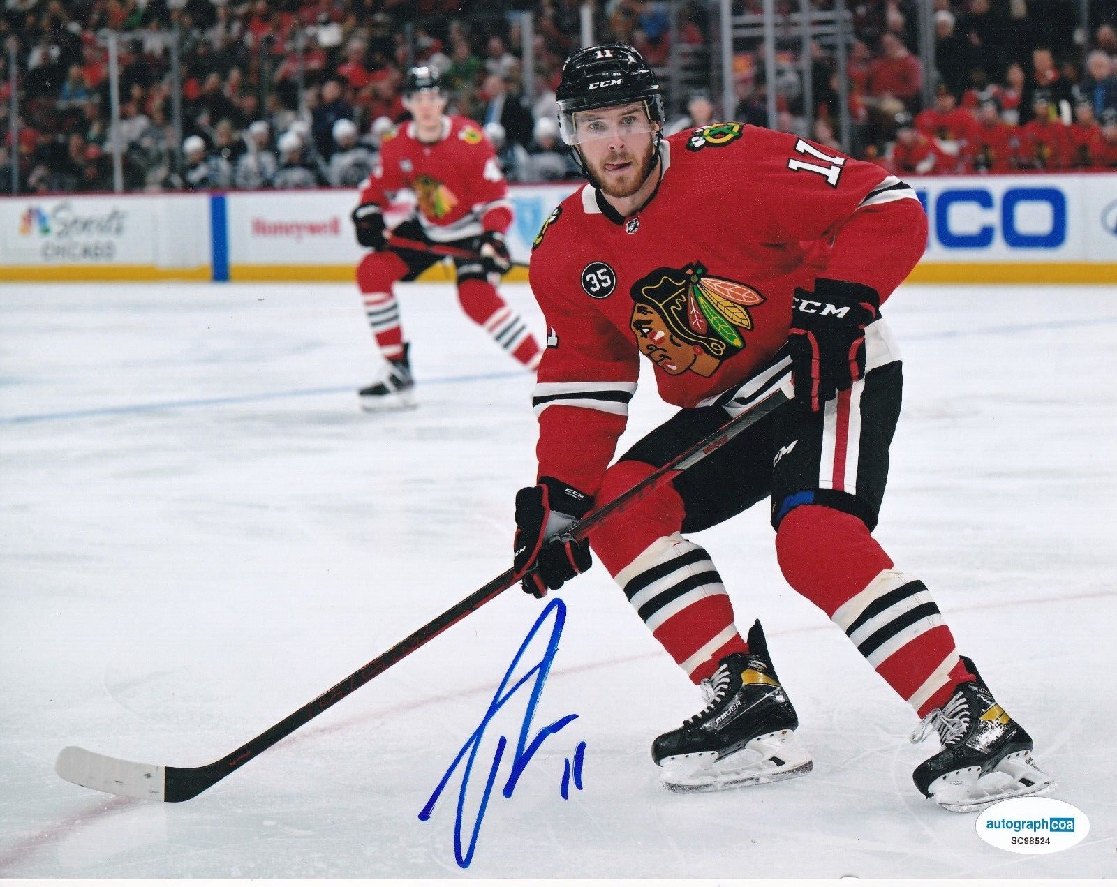TAYLOR RADDYSH  signed (CHICAGO BLACKHAWKS) Hocket 8X10 photo ACOA SC51824