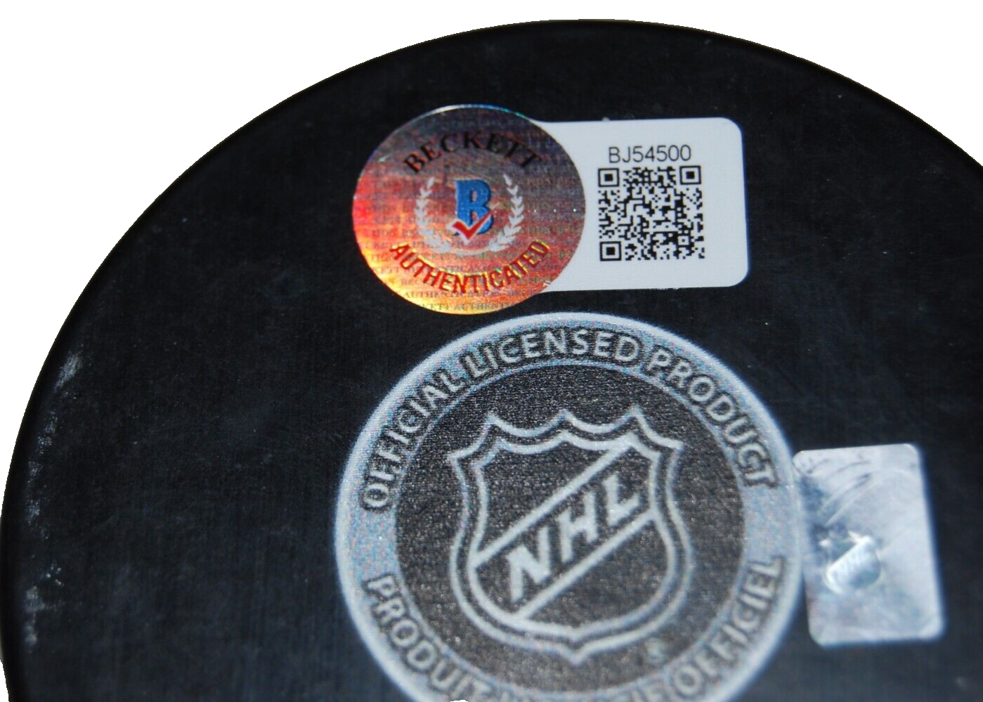KEN HOLLAND signed (EDMONTON OILERS) autographed hockey puck BECKETT BAS BJ54500