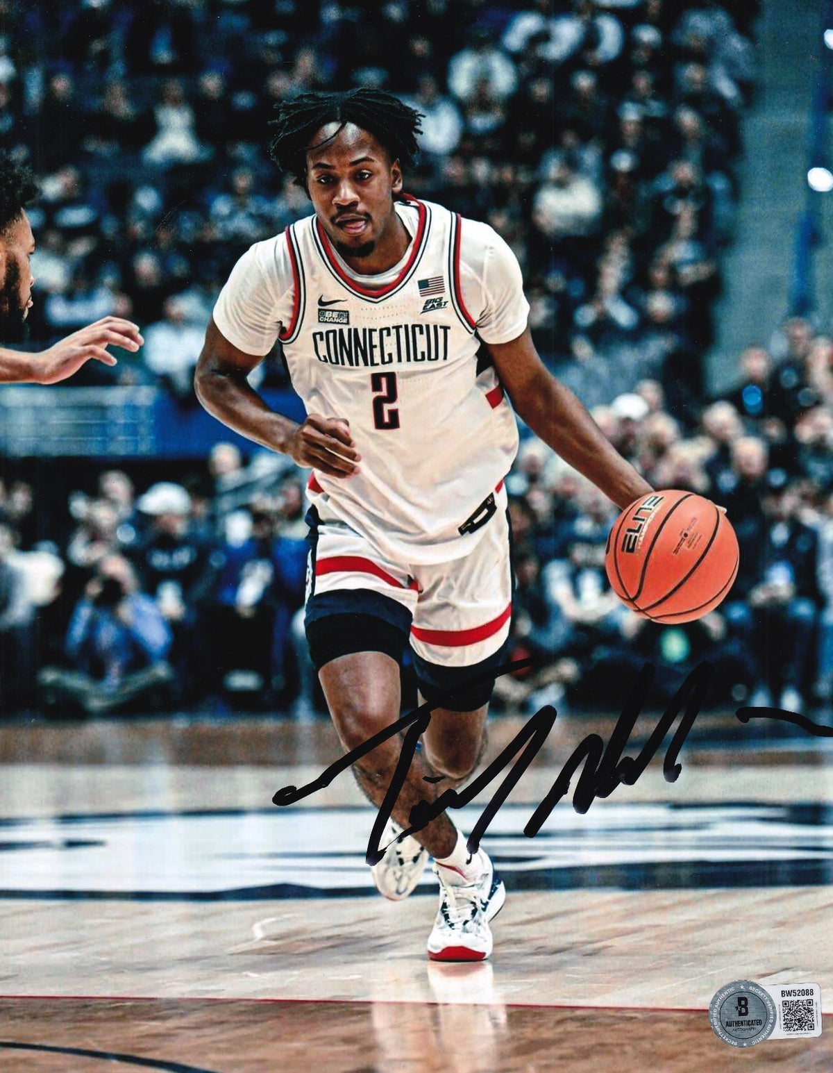 TRISTEN NEWTON signed (UCONN HUSKIES) basketball 8X10 photo BECKETT BW52088
