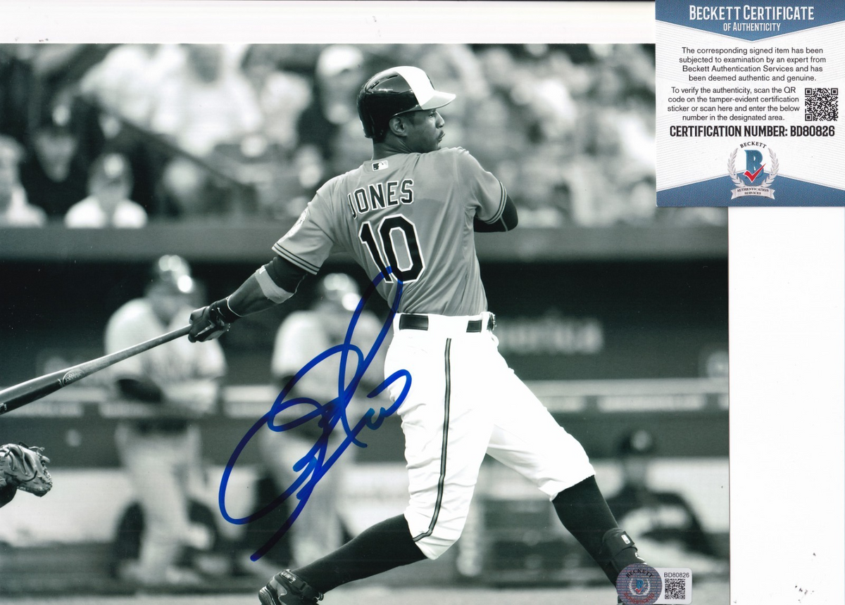 ADAM JONES signed (BALTIMORE ORIOLES) baseball 8X10 photo BECKETT BD80826