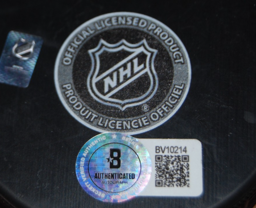 COLTON DACH signed (CHICAGO BLACKHAWKS) 100th Anniversary puck BECKETT BV10214