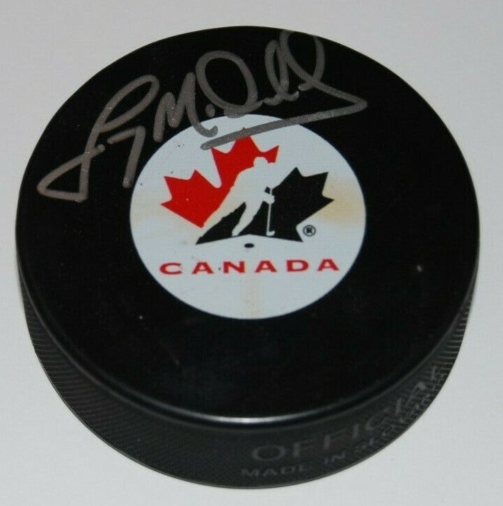 LANNY MCDONALD signed (TORONTO MAPLE LEAFS) Team Canada NHL HOCKEY Puck W/COA 