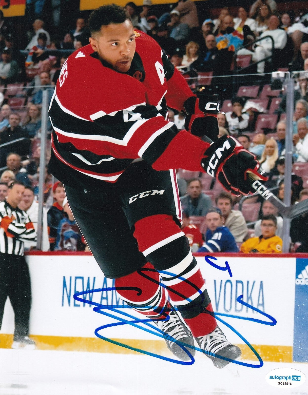 SETH JONES signed (CHICAGO BLACKHAWKS) Hocket 8X10 photo ACOA SC98516